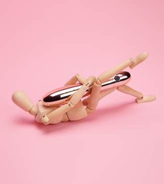 Tantric masturbation using a bullet Wooden figure holding a bullet vibrator between it's legs