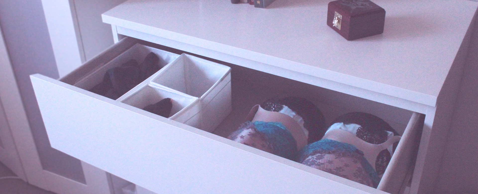 An open lingerie drawer showing a range of beautiful bras