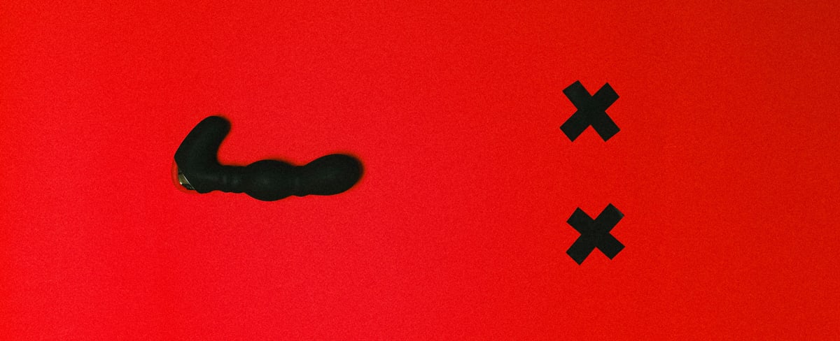 Sex toy on red background
