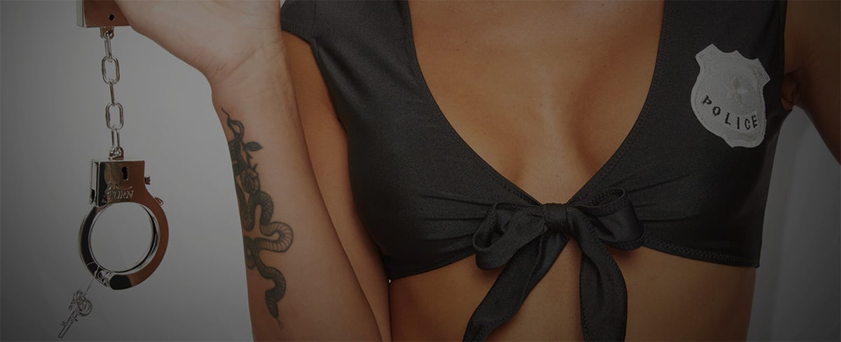 Man in handcuffs gripping a woman's bottom