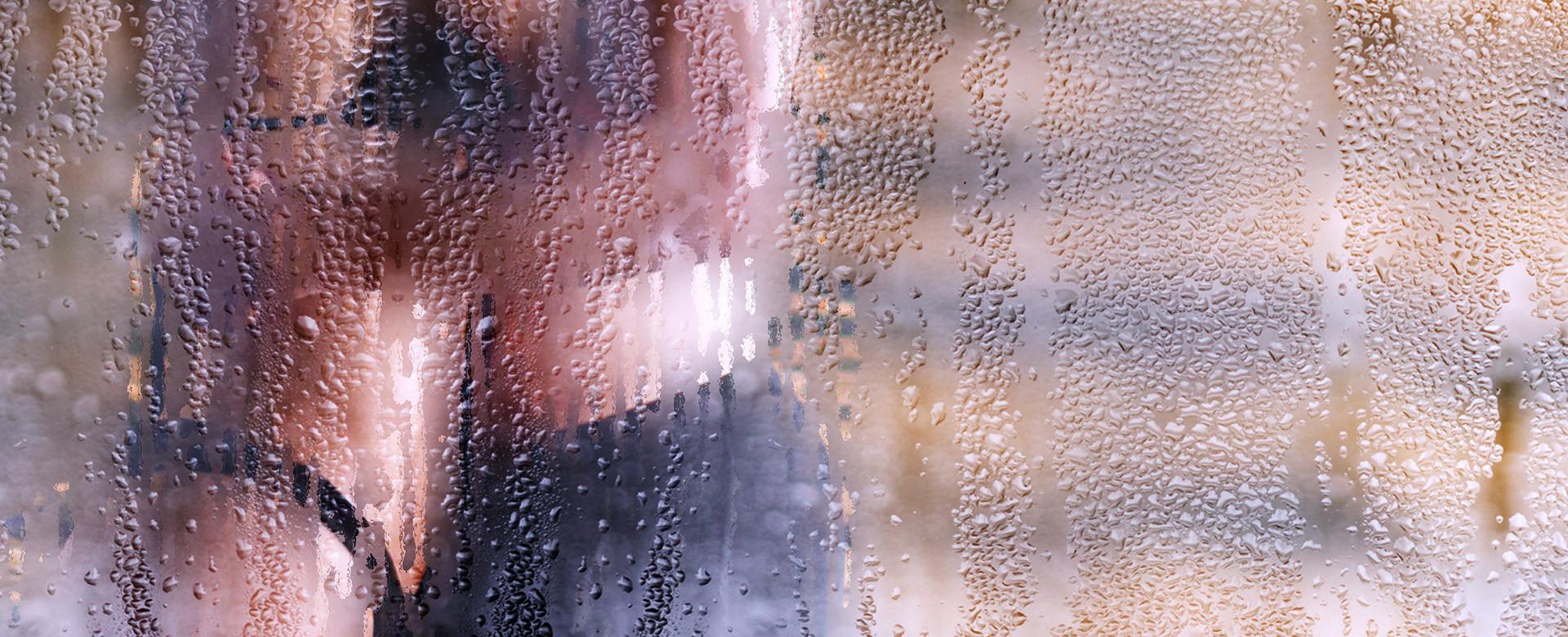 Couple in embrace behind a shower door