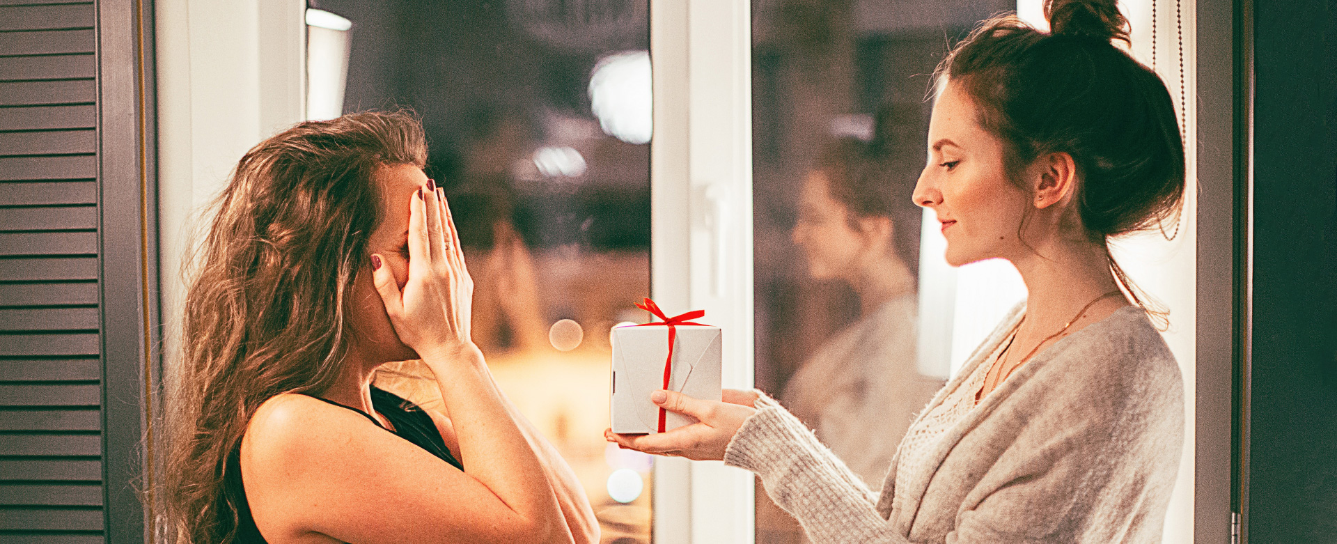 A couple exchaning a gift of lingerie