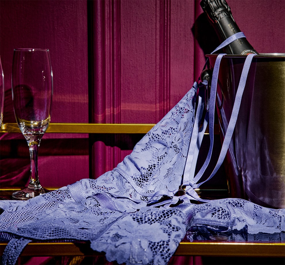Ann Summers Lingerie draped over a bucket of ice and bottle of champagne